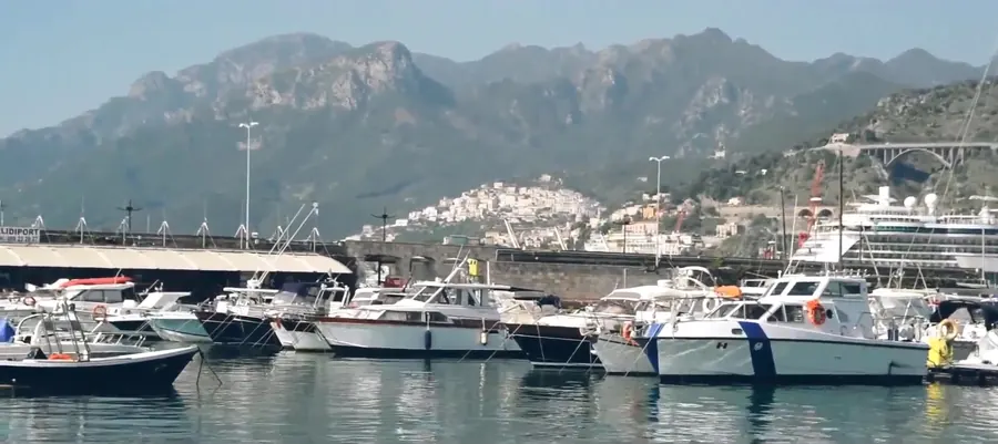 Frame 1 from the video: the Campania coast seen from the boat